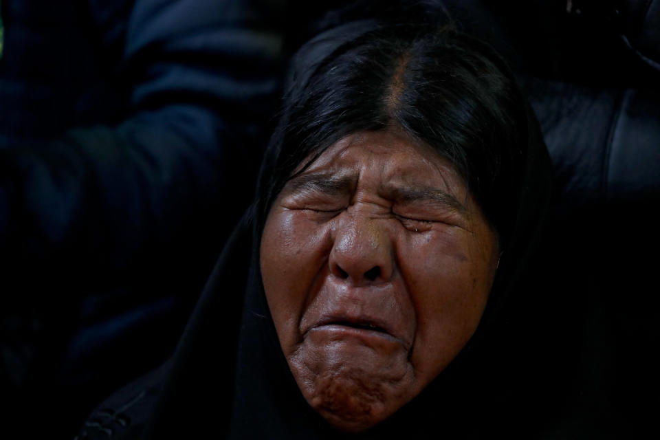 Virginia Ticona mourns during the funeral of her son, Antonio Quispe in El Alto, outskirts of La Paz, Bolivia, Nov. 20, 2019. Quispe was killed on Tuesday when security forces escorting gasoline tankers from a fuel plant clashed with supporters of former President Evo Morales that had been blockading it for five days. (AP Photo/Natacha Pisarenko)