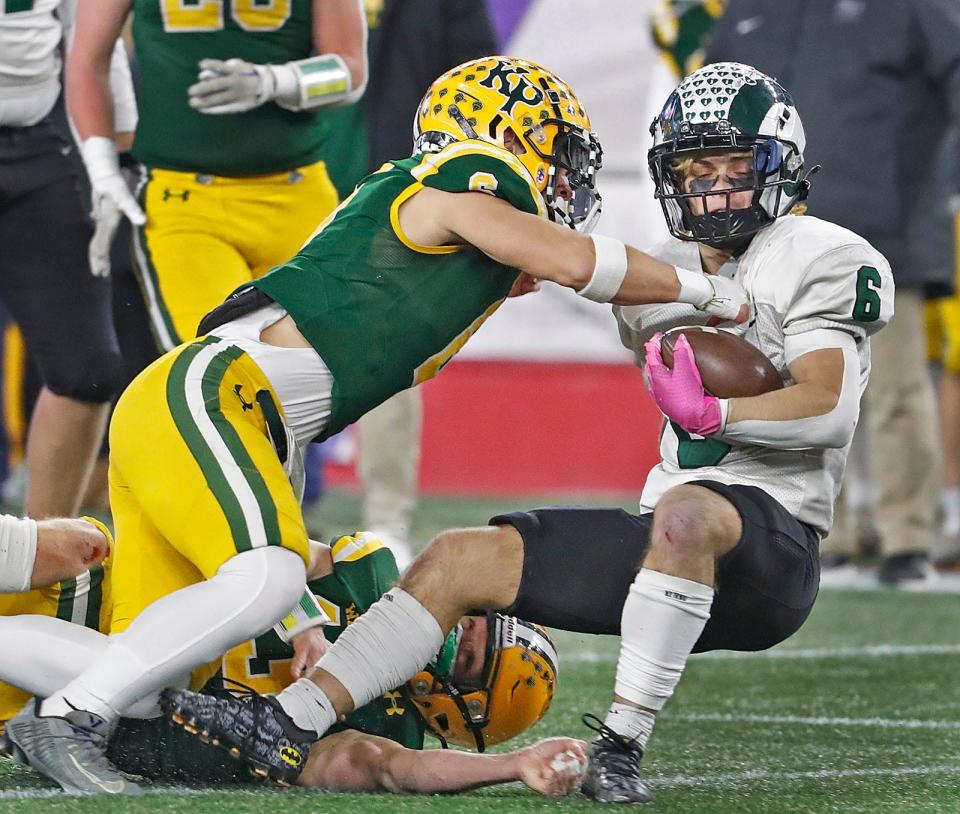 Marshfield's Davin True is stopped at the line of scrimmage during the Div. 2 state final against King Philip at Gillette Stadium on Thursday, Nov. 30, 2023.
