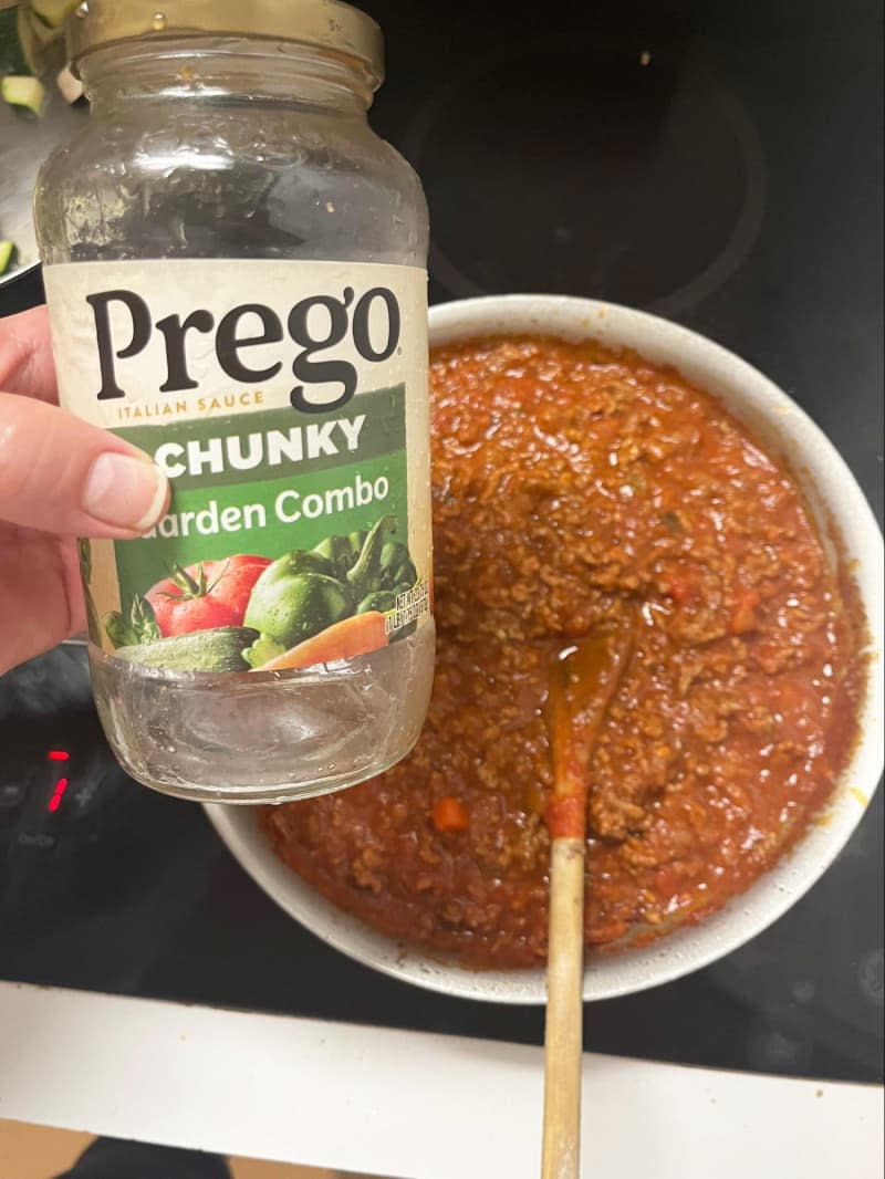 saucepan on stove where meat has been added to prego chunky garden combo sauce