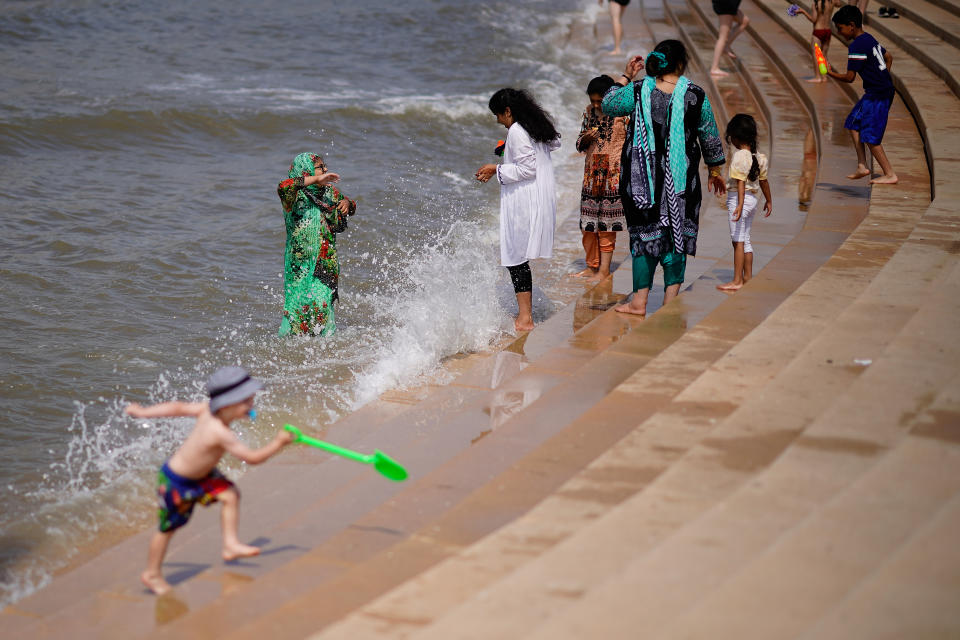 BLACKPOOL, ENGLAND - JULY 27:  Families relax and cool off in the sea on July 27, 2018 in Blackpool, England. The heatwave continues across the United Kingdom with media outlets describing today as "Furnace Friday" after all time record temperatures were predicted by forecasters. The unusual weather pattern is causing traffic and transport delays and is set to bring storms to eastern areas overnight.  (Photo by Christopher Furlong/Getty Images)