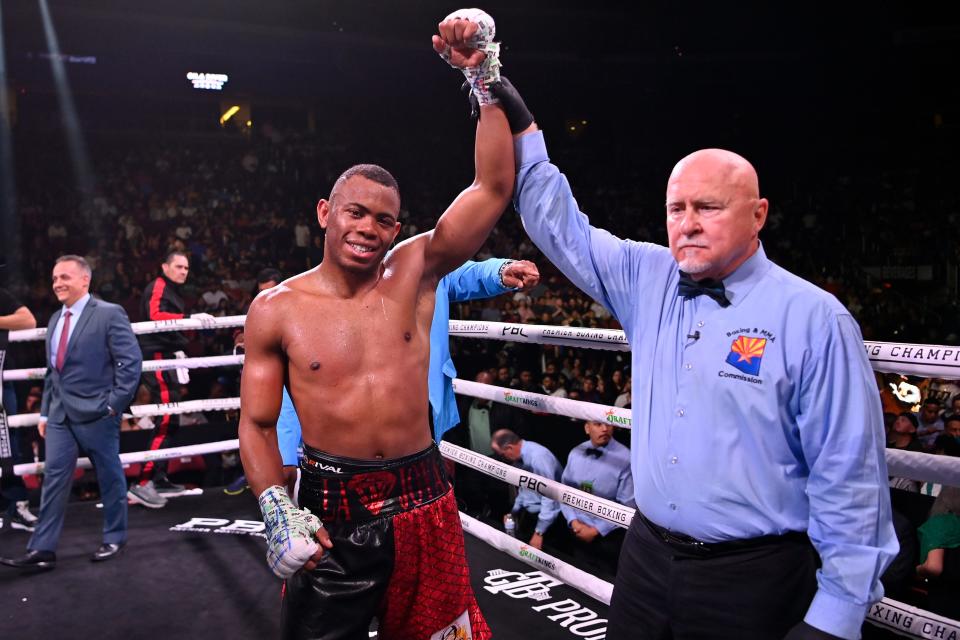 Yoelvis Gomez celebrates his victory by unanimous decision over Jorge Cota in their super welterweight fight at at Gila River Arena on May 21, 2022 in Glendale, Arizona.