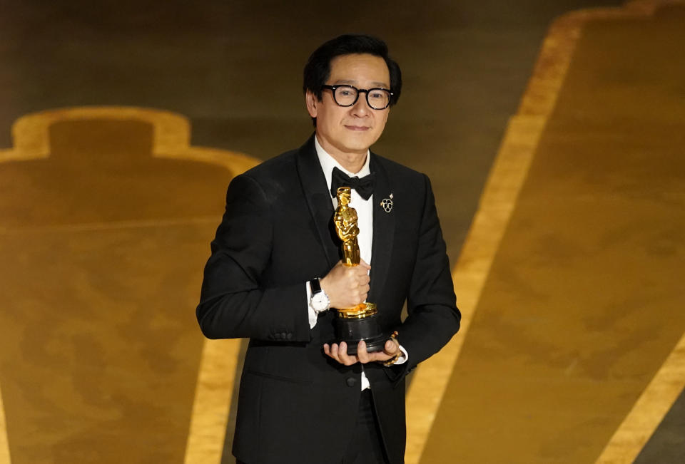 Ke Huy Quan poses onstage with the award for best performance by an actor in a supporting role for "Everything Everywhere All at Once" at the Oscars on Sunday, March 12, 2023, at the Dolby Theatre in Los Angeles. (AP Photo/Chris Pizzello)