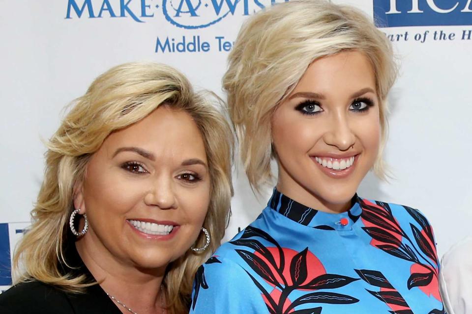 Terry Wyatt/Getty Images (L-R) Julie Chrisley and Savannah Chrisley are pictured. 