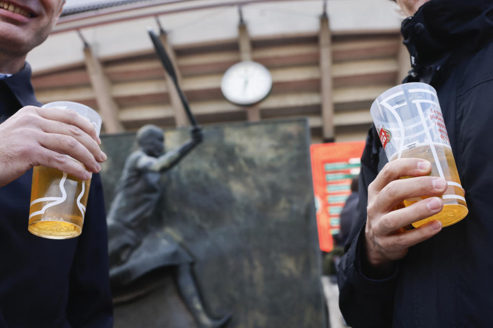 Tennis fans drink beer during second round matches of the French Open tennis tournament at the Roland Garros stadium in Paris, Thursday, May 30, 2024. One player said a French Open spectator threw a piece of gum toward him. Another, No. 1-ranked Iga Swiatek, chastised the crowd at the main stadium for making too much noise during points. So the Grand Slam tournament decided enough was enough: As of Thursday, fans are banned from having alcohol in the stands. (AP Photo/Jean-Francois Badias)