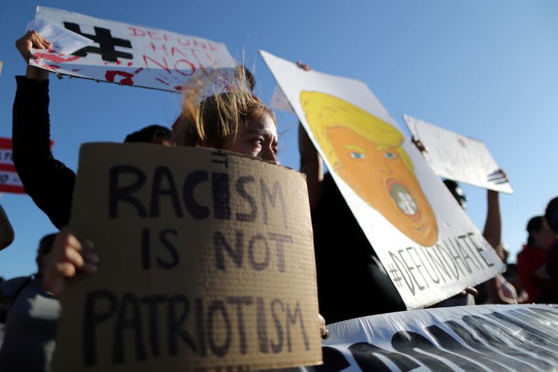 FILE PHOTO: FILE PHOTO: People protest outside the ICE immigration detention center in Adelanto