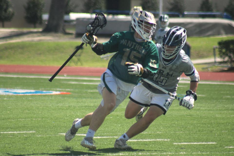 Nease midfielder Paxton Wolfe (15) advances upfield against Tallahassee Maclay.