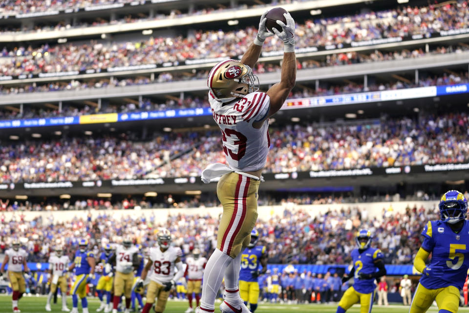 San Francisco 49ers running back Christian McCaffrey makes a touchdown catch as Los Angeles Rams cornerback Jalen Ramsey, right, watches during the second half of an NFL football game Sunday, Oct. 30, 2022, in Inglewood, Calif. (AP Photo/Ashley Landis)