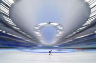 An athlete from the Netherlands skates during a speed skating practice session ahead of the 2022 Winter Olympics, Thursday, Feb. 3, 2022, in Beijing. (AP Photo/Ashley Landis)