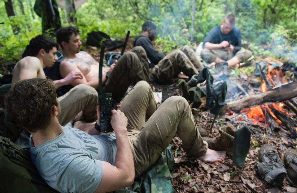 Airmen by campfire combat survival training