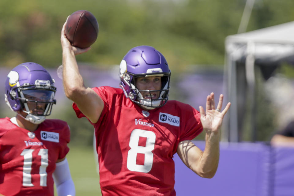 Minnesota Vikings quarterback Kirk Cousins throws at the NFL football team's practice facility in Eagan, Minn., Monday, Aug. 1, 2022. (AP Photo/Andy Clayton-King)