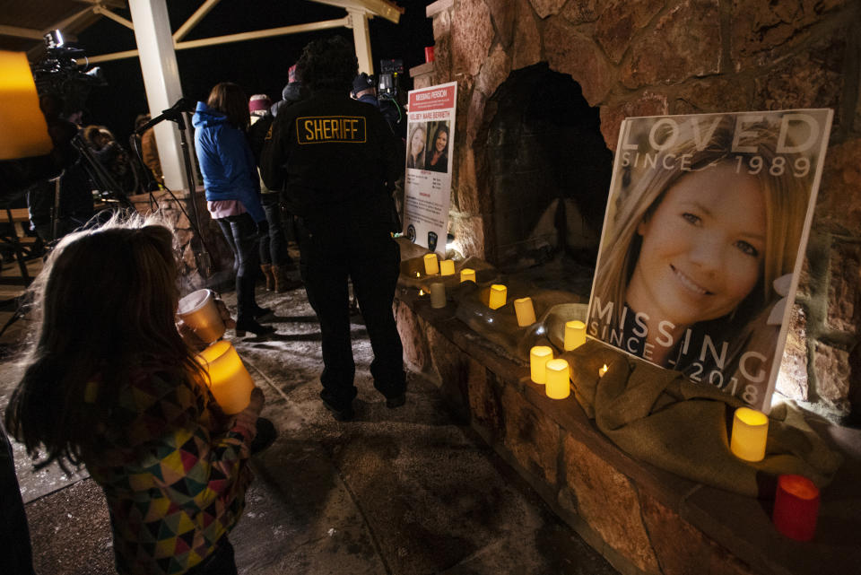 Community members hold a candlelight vigil for Kelsey Berreth under the gazebo of Memorial Park in Woodland Park, Colo., on Thursday, Dec. 13, 2018. Berreth was last seen on Thanksgiving Day, captured on surveillance video entering a grocery store with what appears to be her 1-year-old daughter in a baby carrier. Weeks later, investigators don't know what happened to the 29-year-old Colorado mother. (Kelsey Brunner/The Gazette via AP)