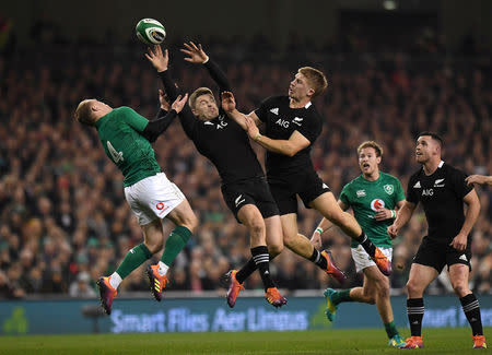 Rugby Union - Ireland v New Zealand - Aviva Stadium, Dublin, Ireland - November 17, 2018 Ireland's Keith Earls in action with New Zealand's Beauden Barrett and Jack Goodhue REUTERS/Clodagh Kilcoyne