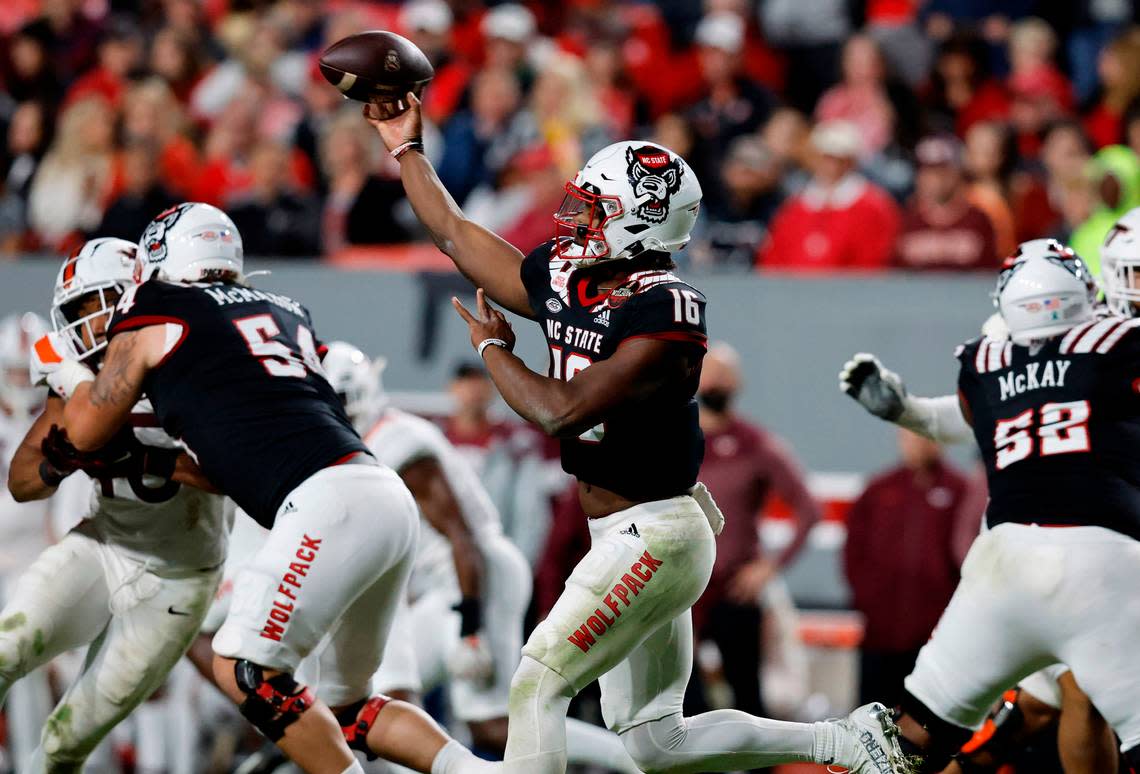 N.C. State quarterback MJ Morris (16) passes during the second half of N.C. State’s 22-21 victory over Virginia Tech at Carter-Finley Stadium in Raleigh, N.C., Thursday, Oct. 27, 2022. Ethan Hyman/ehyman@newsobserver.com