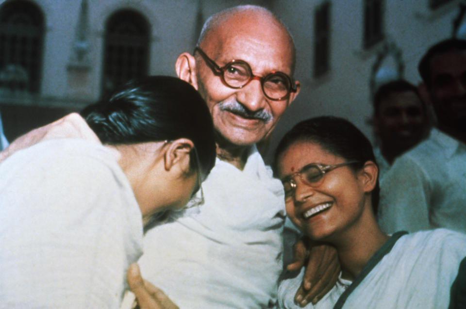 Mahatma Ghandi enjoys a laugh with his two granddaughters Ava and Manu at Birla House in New Delhi.