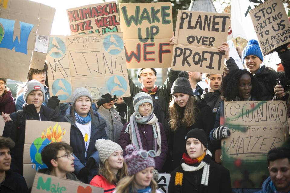 Swedish climate activist Greta Thunberg, center, is pictured during a "Fridays for Future" demo on the final day of the 50th annual meeting of the World Economic Forum, WEF, in Davos, Switzerland, Friday, Jan. 24, 2020. (Gian Ehrenzeller/Keystone via AP)