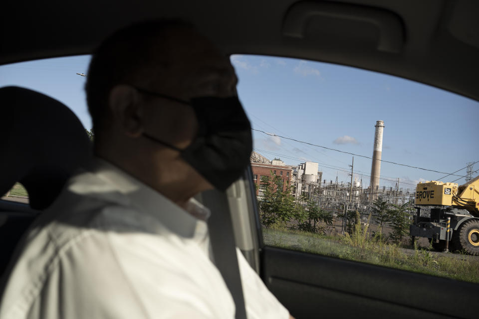 Dr. Mark Mitchell, former director of Hartford's health department and a founder of the Connecticut Coalition for Environmental Justice, drives his car along the South Meadows neighborhood of Hartford, Conn., on Tuesday, Sept. 13, 2022. Mitchell says his research and work have led him to believe that the state's asthma rates are heavily tied to traffic-related air pollution, as well as other air pollutants: "Connecticut has the highest air pollution of any state east of the Mississippi." (AP Photo/Wong Maye-E)