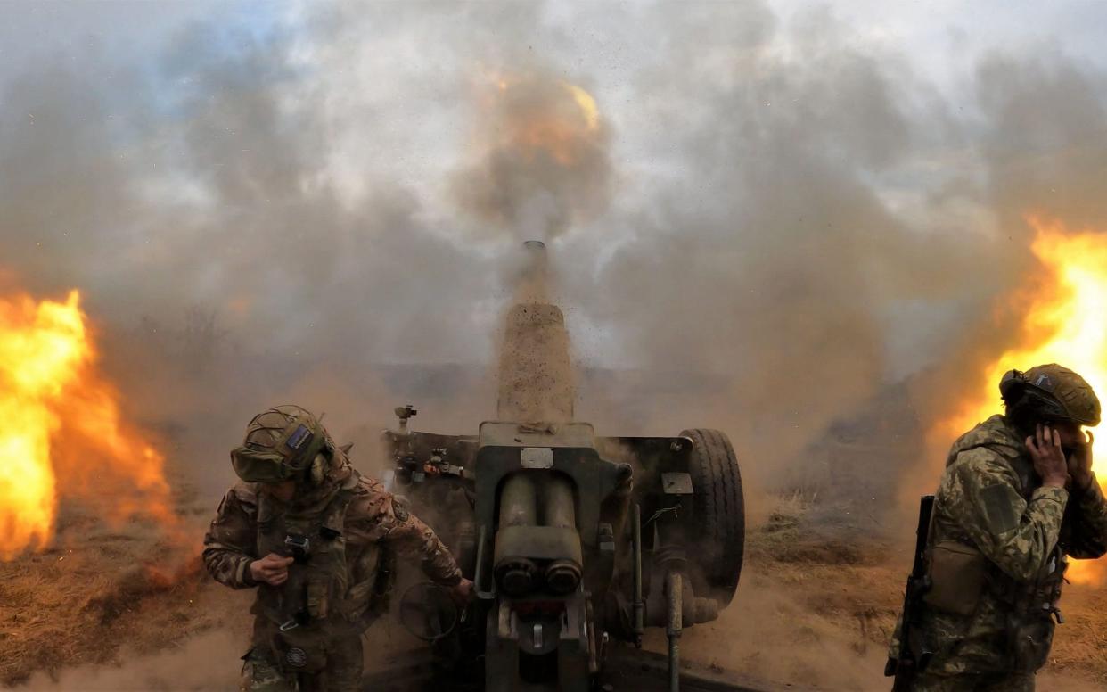 Ukrainian servicemen fire with a D-30 howitzer at Russian positions near Bakhmut - AFP