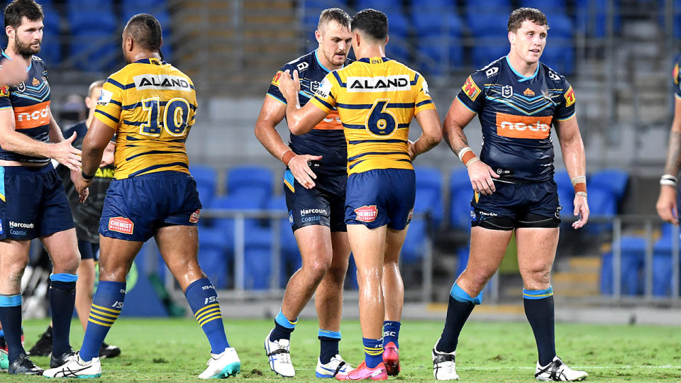 Gold Coast Titans and Parramatta Eels players, pictured here shaking hands after their match on Sunday night.