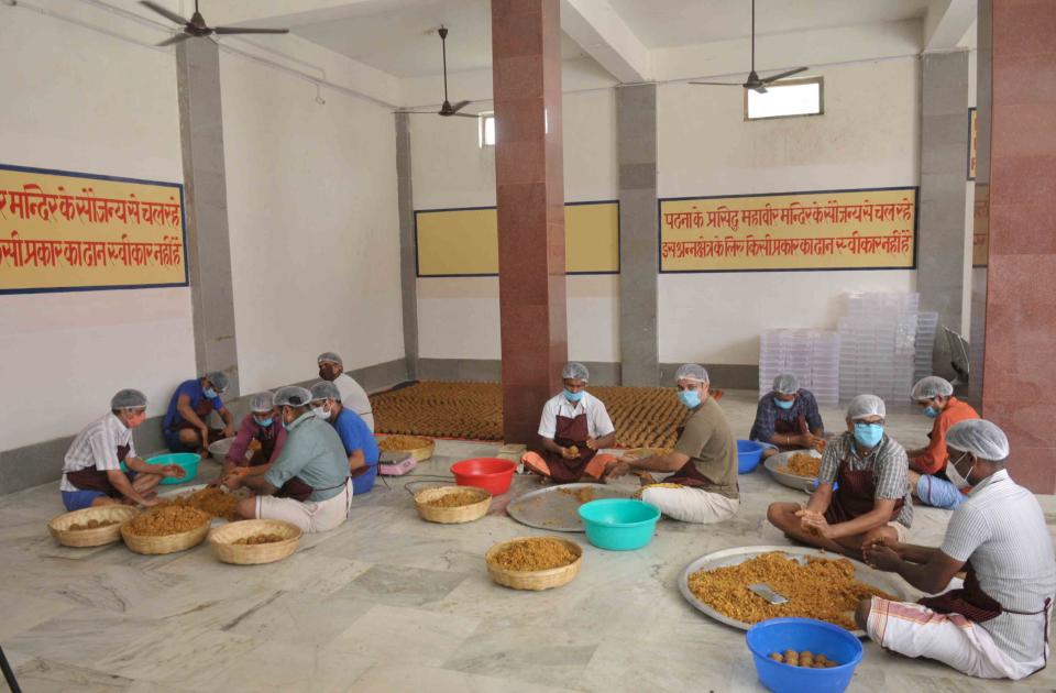 AYODHYA, INDIA - AUGUST 4: An estimated 1.25 Lakh laddus are being prepared by Mahavir Temple Trust Patna on the eve of the foundation stone laying ceremony of the Ram Janmabhumi temple on August 4, 2020 in Ayodhya, India. Prime Minister Narendra Modi will on Wednesday attend a public function on laying of the foundation stone of 'Shree Ram Janmabhoomi Mandir' at Ayodhya. Ram Janmabhoomi Teerth Kshetra, the trust set up for the construction and management of Ram temple, has invited 175 eminent guests for the foundation stone-laying ceremony after personally discussing with BJP veterans L K Advani and Murli Manohar Joshi, lawyer K Parasaran and other dignitaries. (Photo by Deepak Gupta/Hindustan Times via Getty Images)