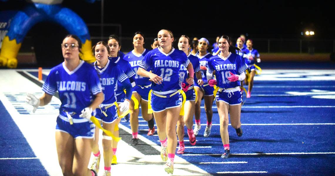 The Atwater High School girls flag football team takes the field prior to their playoff game against Ceres on Thursday, Oct. 26, 2023.