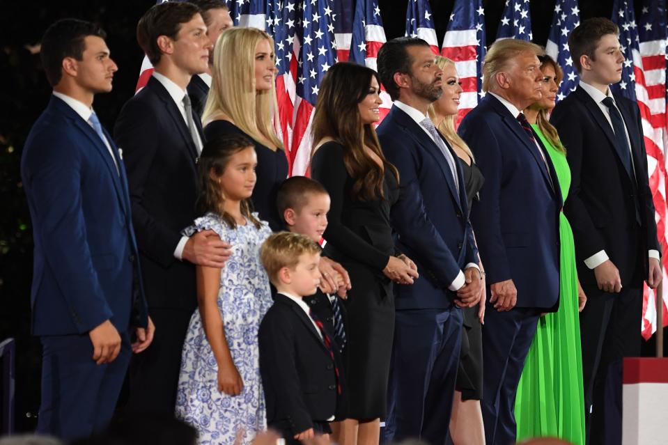 Barron Trump, First Lady Melania Trump, US President Donald Trump, Tiffany Trump, Donald Trump Jr., Kimberly Guilfoyle, Lara Trump, Eric Trump, Ivanka Trump, Jared Kushner and Michael Boulos stand after the president delivered his acceptance speech for the Republican Party nomination for reelection during the final day of the Republican National Convention at the South Lawn of the White House in Washington, DC on August 27, 2020.