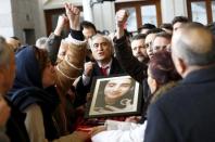 Relatives of Elvin Bugra Arslan, one of the victim of Sunday's suicide bomb attack, react during his funeral ceremony in Ankara, Turkey March 15, 2016. REUTERS/Umit Bektas