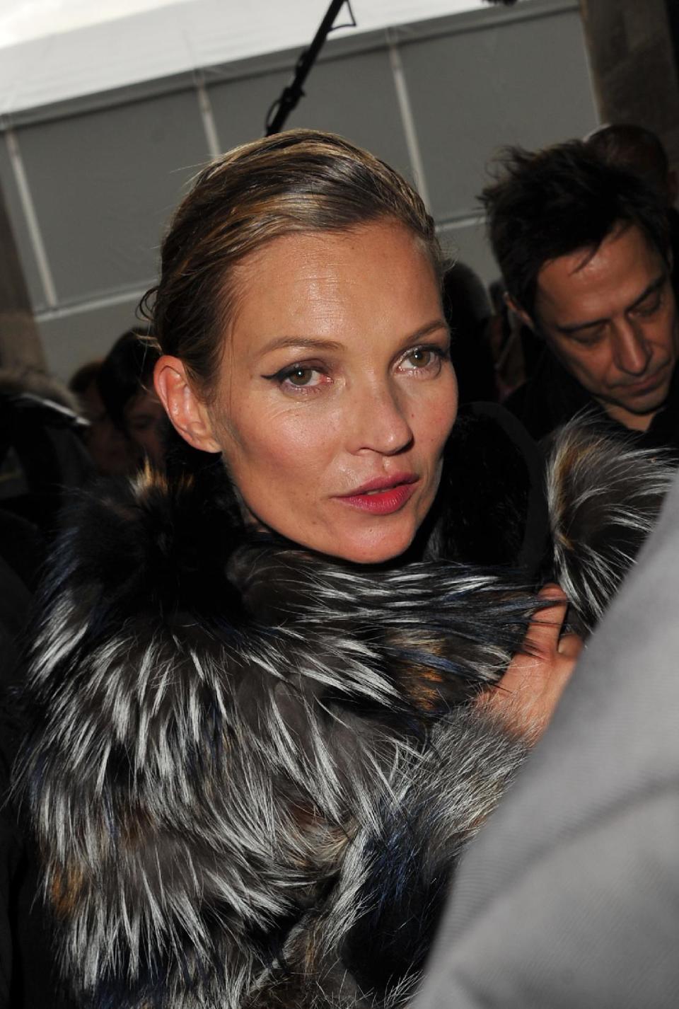 Top model Kate Moss and Jamie Hince, right, leave Louis Vuitton's Ready to Wear's Fall-Winter 2013-2014 fashion collection, Wednesday, March 6, 2013 in Paris. (AP Photo/Zacharie Scheurer)