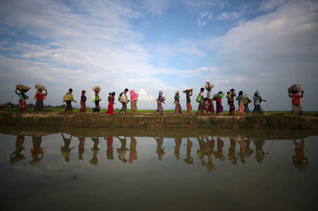 FILE PHOTO: Rohingya refugees continue to make their way after crossing from Myanmar into Palang Khali, near Cox's Bazar, Bangladesh, November 2, 2017. To match Special Report MYANMAR-FACEBOOK/HATE REUTERS/Hannah McKay/File Photo