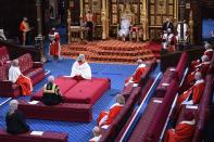 Queen Elizabeth II reads the Queen's Speech on the The Sovereign's Throne in the socially distanced House of Lords chamber