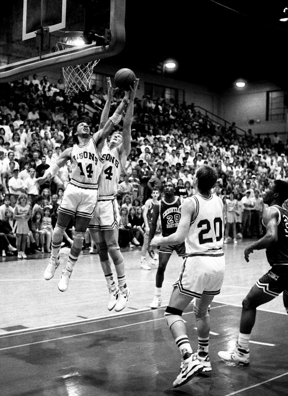 David Lipscomb teammates Marcus Bodie (14) and Philip Hutcheson battle for a rebound as the nation’s No. 1-ranked NAIA team defeated Christian Brothers of Memphis 103-91 before 3,300 at McQuiddy Gym on Feb. 2, 1989, to extend its winning streak to 31 games.