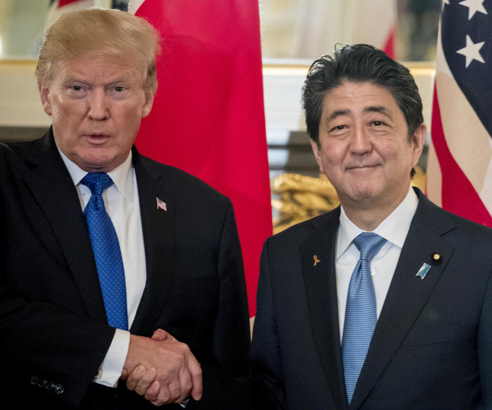 FILE - In this Nov. 6, 2017, file photo, U.S. President Donald Trump, left, and Japanese Prime Minister Shinzo Abe shake hands before a bilateral meeting at the Akasaka Palace in Tokyo. Trump will make a state visit to Japan at the end of May, 2019 to meet the nation's new emperor. (AP Photo/Andrew Harnik, File)