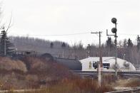 Emergency crews work at the scene of a train derailment near Gainford, Alberta, on Saturday, October 19, 2013. THE CANADIAN PRESS/Jason Franson