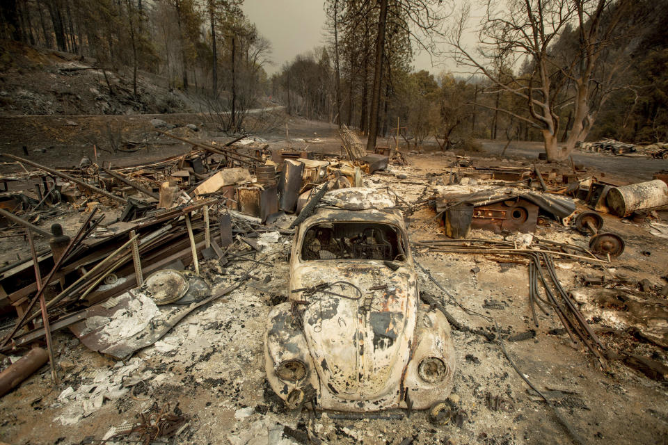 A scorched VW Beetle rests in a clearing after the Delta Fire burned through the Lamoine community in the Shasta-Trinity National Forest, Calif., on Thursday, Sept. 6, 2018. (AP Photo/Noah Berger)