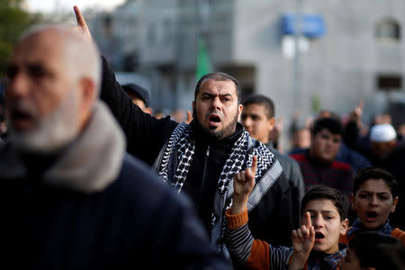 Palestinian Hamas supporters take part in a rally in support of the West Bank shooting attack, in the northern Gaza Strip March 17, 2019. REUTERS/Mohammed Salem