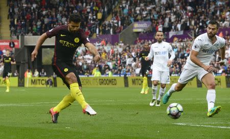 Britain Football Soccer - Swansea City v Manchester City - Premier League - Liberty Stadium - 24/9/16 Manchester City's Sergio Aguero scores their first goal Reuters / Rebecca Naden Livepic