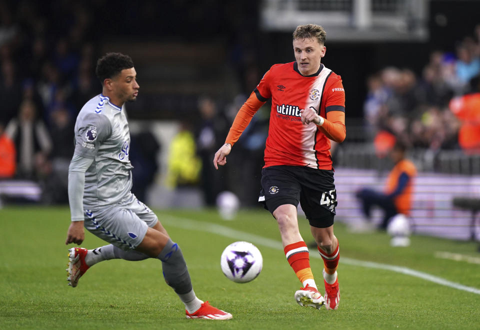 Everton's Ben Godfrey, left, and Luton Town's Alfie Doughty in action during the English Premier League soccer match between Luton Town and Everton at Kenilworth Road, Luton, Friday May 3, 2024. (Bradley Collyer/PA via AP)