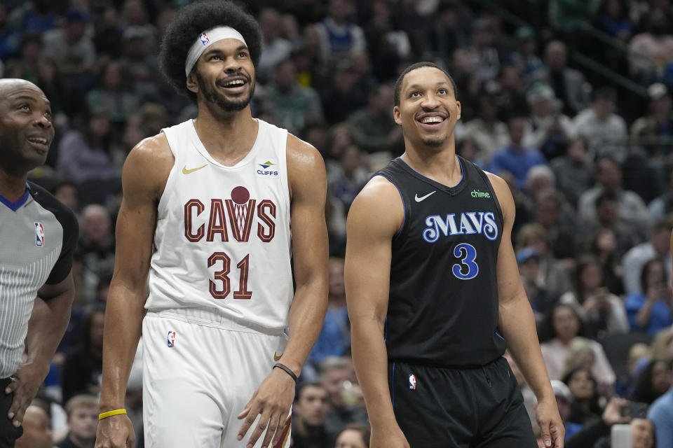 Cleveland Cavaliers center Jarrett Allen (31) and Dallas Mavericks forward Grant Williams (3) share a laugh during the first half of an NBA basketball game in Dallas, Wednesday, Dec. 27, 2023. (AP Photo/LM Otero)