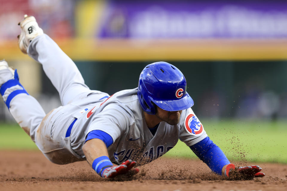 Chicago Cubs' Alfonso Rivas slides into third base after hitting a two-RBI triple during the third inning of a baseball game against the Cincinnati Reds in Cincinnati, Tuesday, May 24, 2022. (AP Photo/Aaron Doster)
