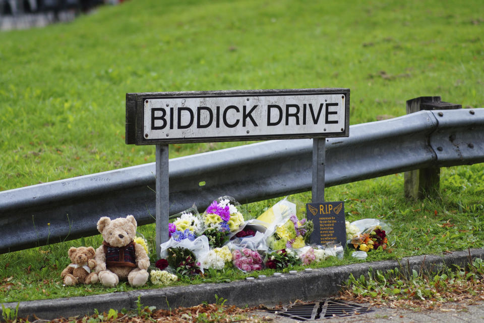 Bouquets of flowers and stuffed toys are placed Saturday, Aug. 14, 2021 at Biddick Drive in the Keyham area of Plymouth, England, where a young man who killed five people and then took his own life on Thursday. Police said the motive for the shootings was unclear but there were no immediate signs that the crime was an act of terrorism. (Ben Birchall/PA via AP)