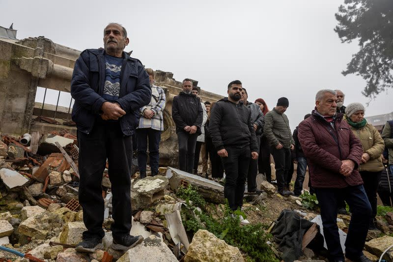 Worshippers attend a mass for those of their community killed by last year's earthquake at Greek Orthodox Church in Hatay