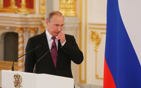 Russian President Vladimir Putin attends a personal send-off for members of the Russian Olympic team at the Kremlin in Moscow, Russia, July 27, 2016. REUTERS/Maxim Shemetov