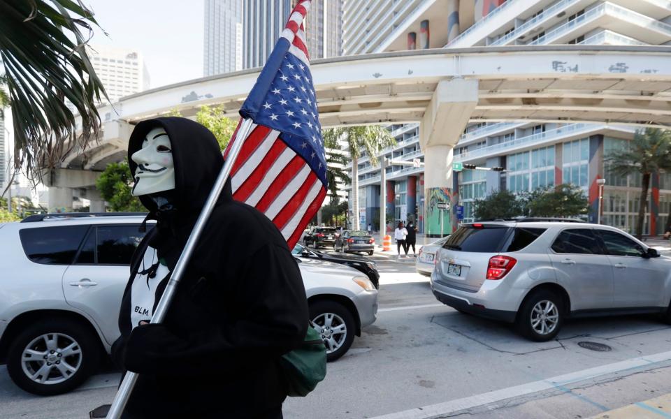 A protestor in Miami  - AP