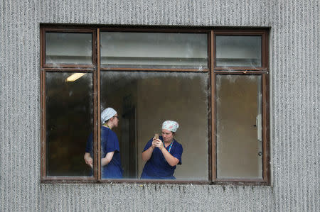 Staff are seen in a hospital in Christchurch, New Zealand March 18, 2019. REUTERS/Jorge Silva