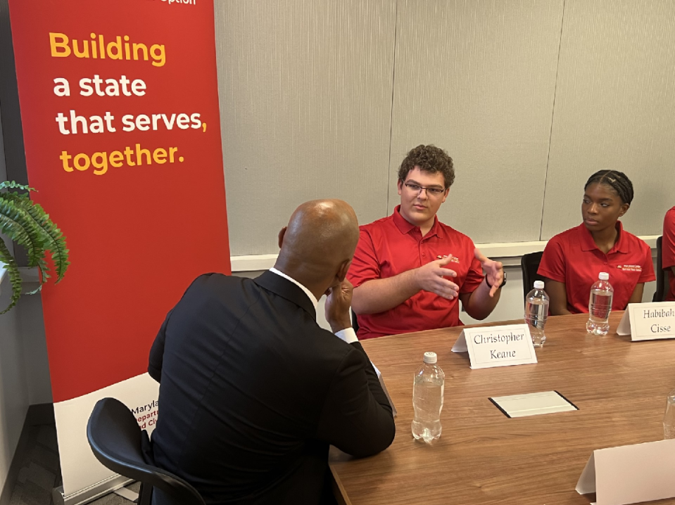 In this file photo, Washington County resident Christopher Keane, a member of the Maryland Corps/Service Year Option programs, speaks to Gov. Wes Moore during a roundtable after the launch event for the new Service Year Option program in College Park, Maryland on October 27, 2023.