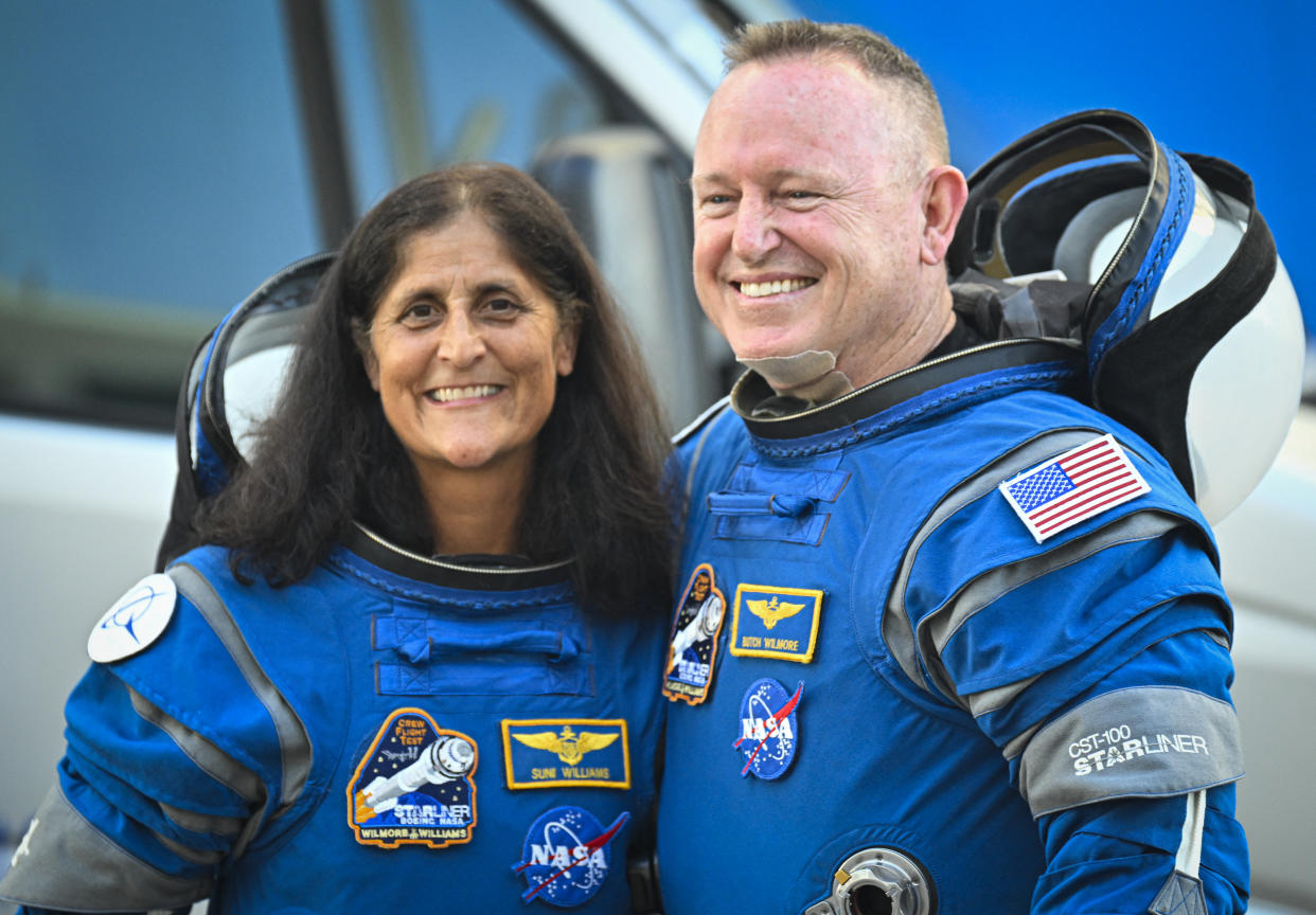 NASA astronauts  Butch Wilmore and Suni Williams, wearing Boeing spacesuits, before boarding the Boeing Starliner.