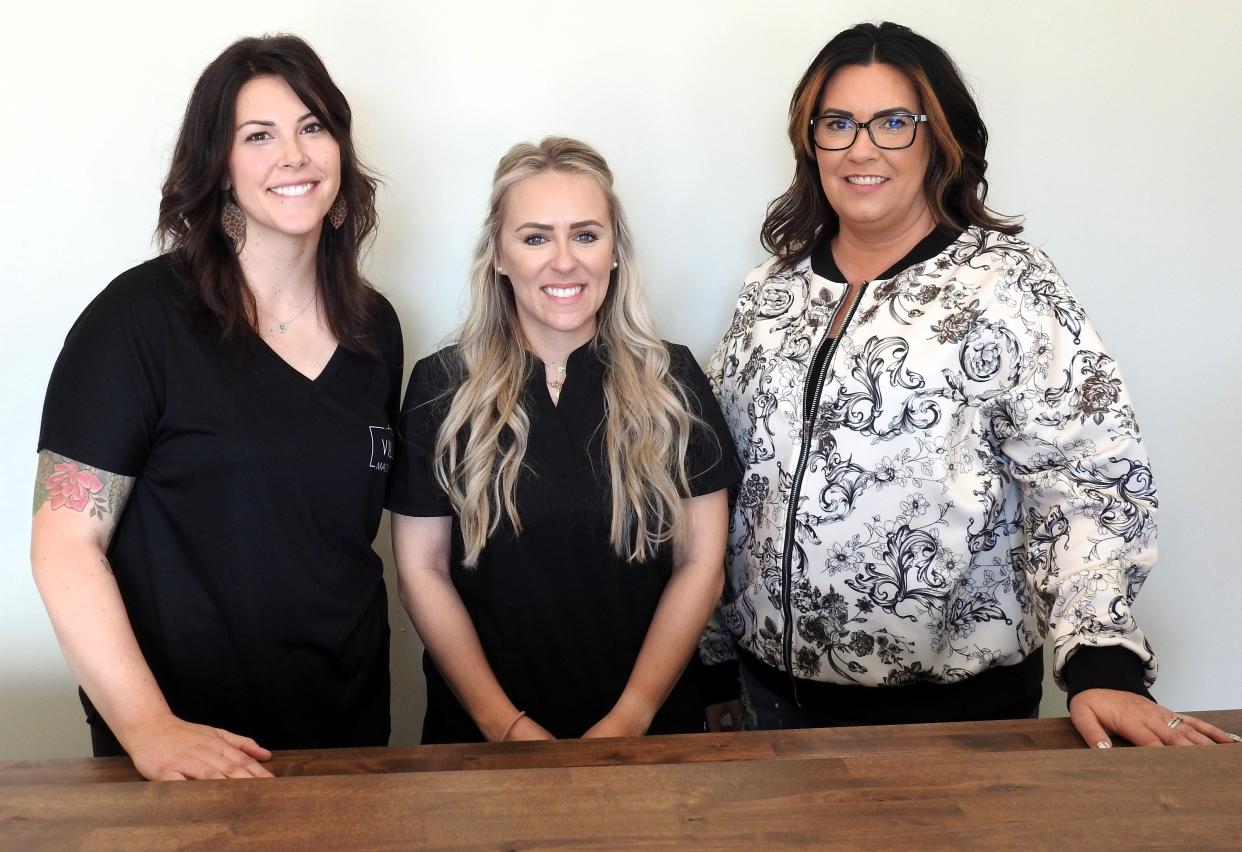Kayci Dickerson of Village Massotherapy, Terri Grove of Palmbay Studio and Missy Courtright of Nails by Missy all recently opened storefronts in the Bickstone Building in West Lafayette. The building also has a dog groomer and seven apartments with one storefront still open.