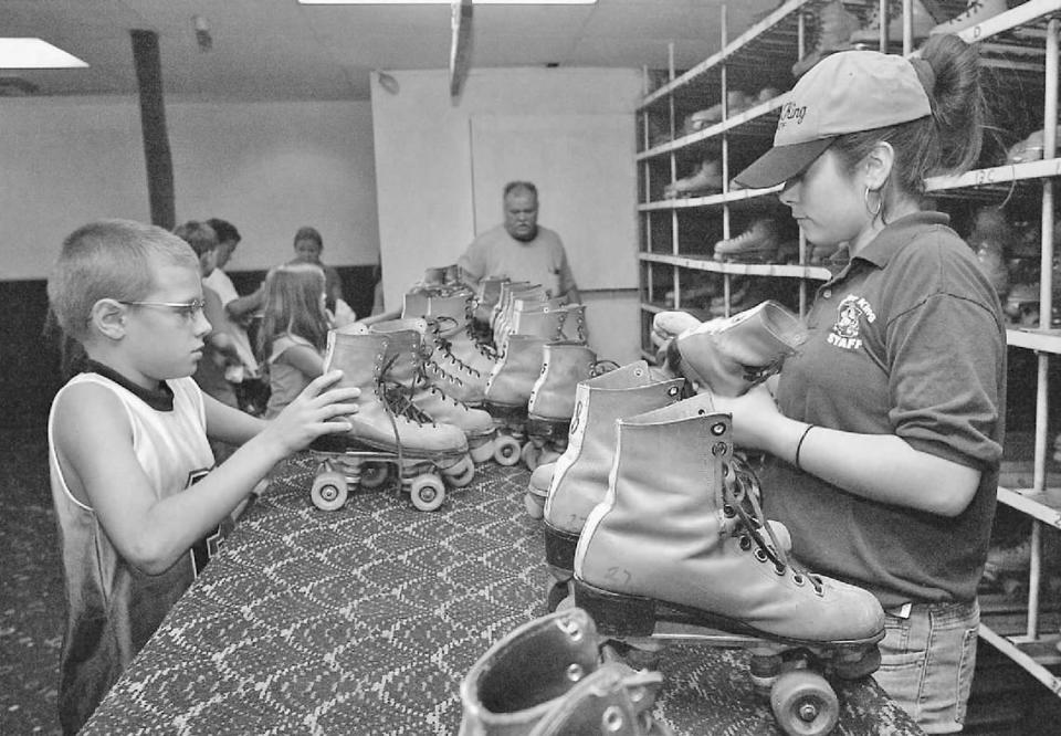 In this archive photo from 2005, Jacob Norstrom is seen returning his rented skates to Roller King employee Angelica Murilla after an afternoon skate session.