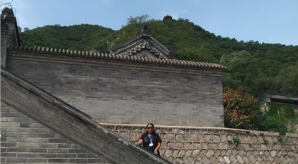 Maxine Starr, seen here at the Great Wall of China, says "Being a visually impaired person, there is little room for unforeseen anything when out and about during the daily activities, but traveling abroad intensifies the preplanning for any eventuality even more."