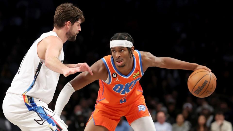 Jan 15, 2023; Brooklyn, New York, USA; Oklahoma City Thunder guard Shai Gilgeous-Alexander (2) controls the ball against Brooklyn Nets forward Joe Harris (12) during the fourth quarter at Barclays Center.