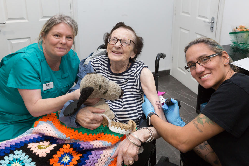 Care home resident geting her first tattoo